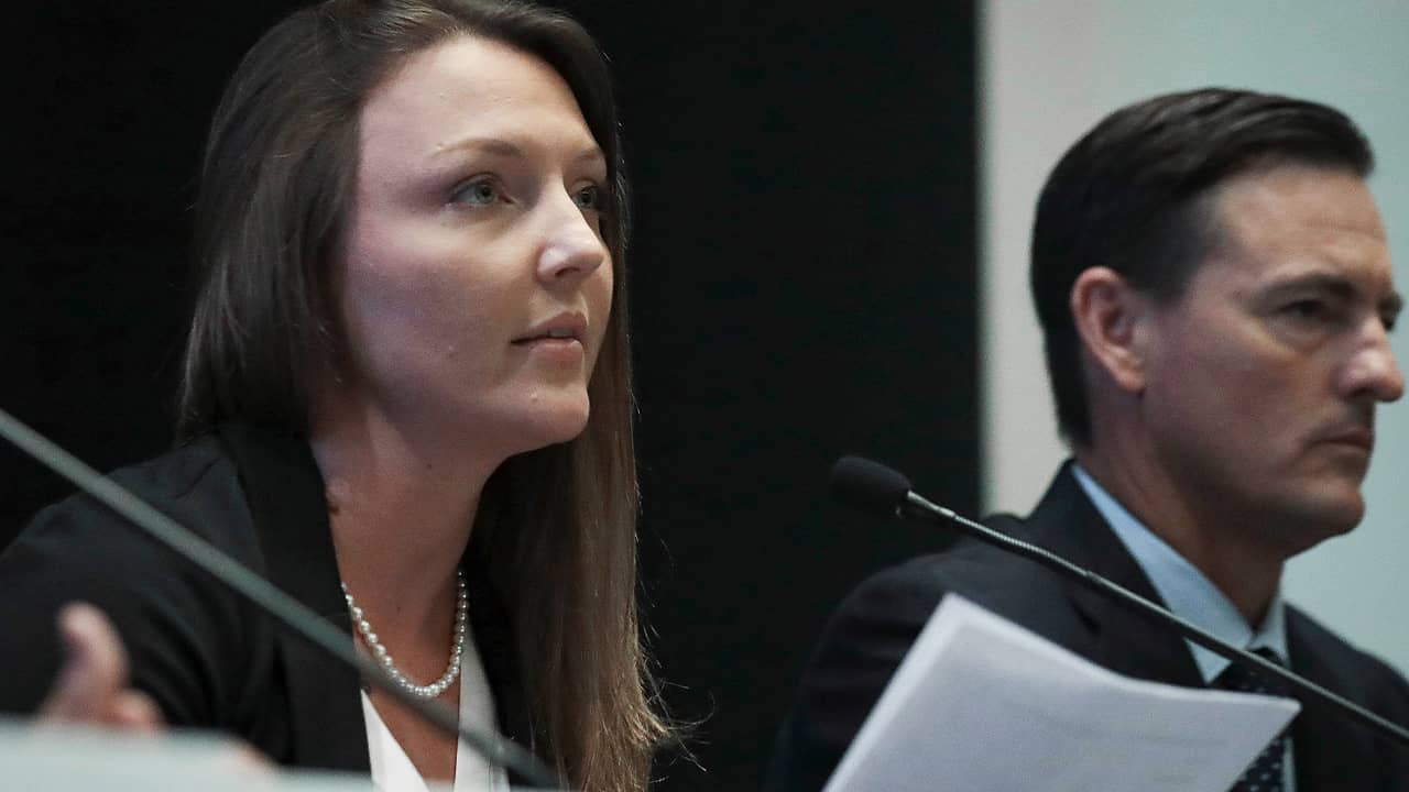 Photo of Courtney Wild and her attorney