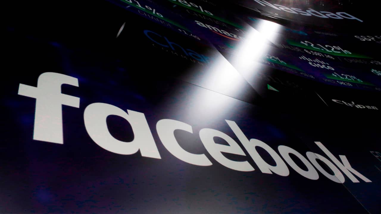 Photo of Facebook logo appearing on a screen at the Nasdaq MarketSite in New York