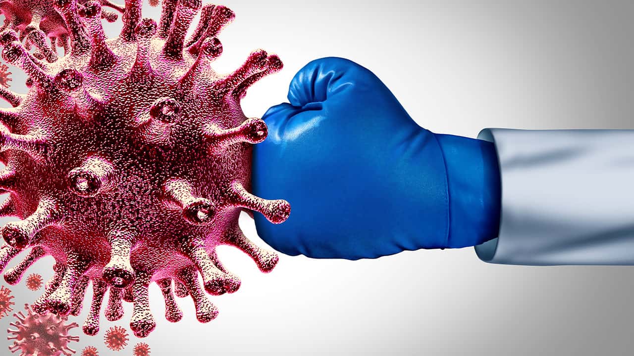 Image of a gloved hand landing a punch against the coronavirus