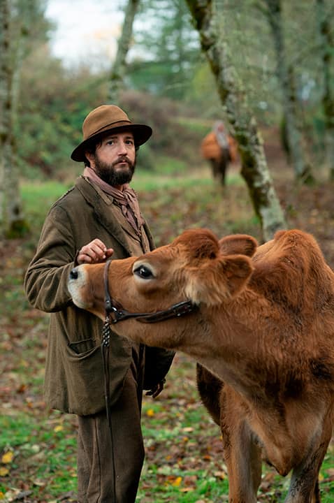Photo of a scene from "First Cow." 