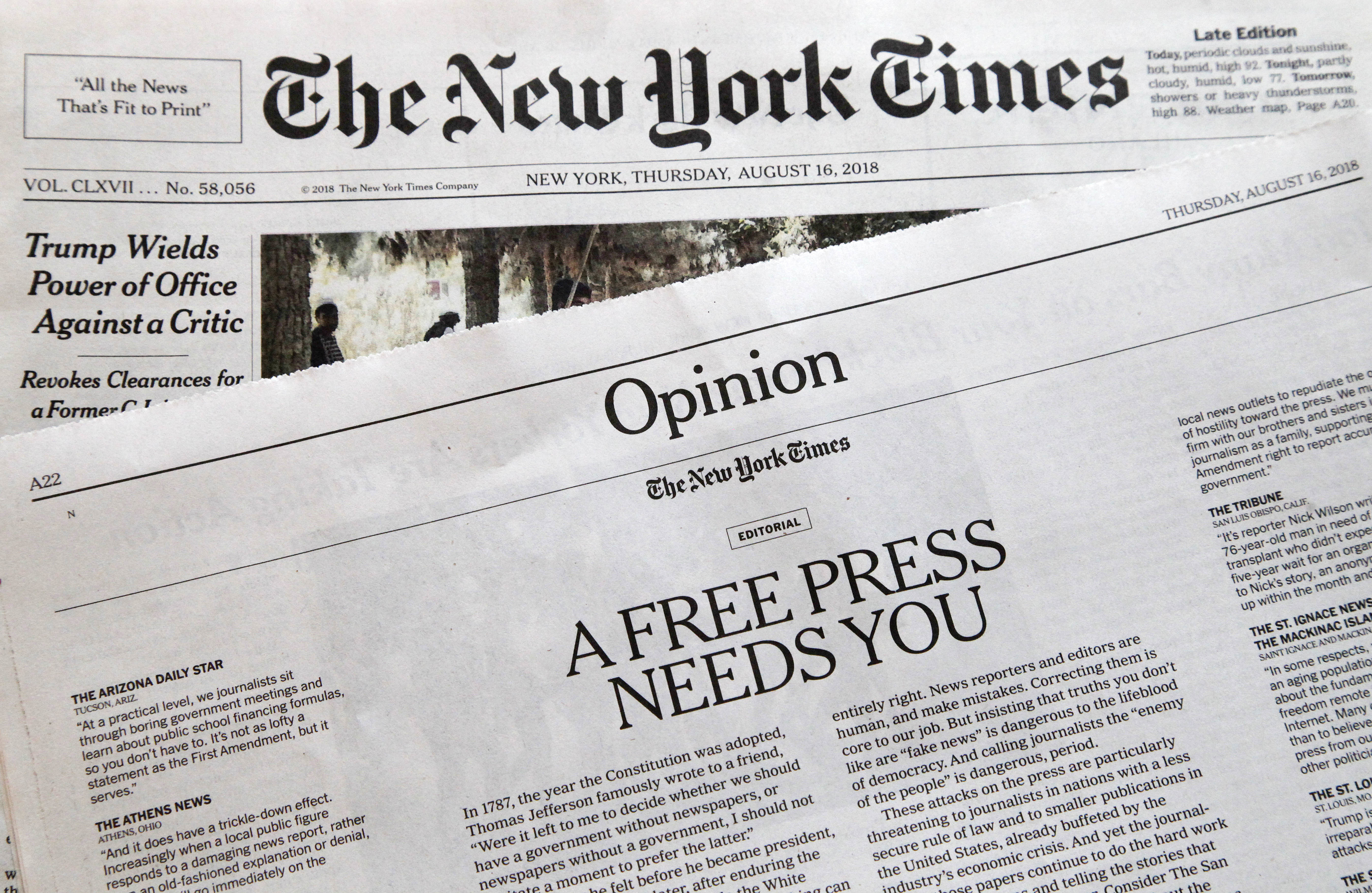 Photo of editorials from New York Times and Boston Glove 