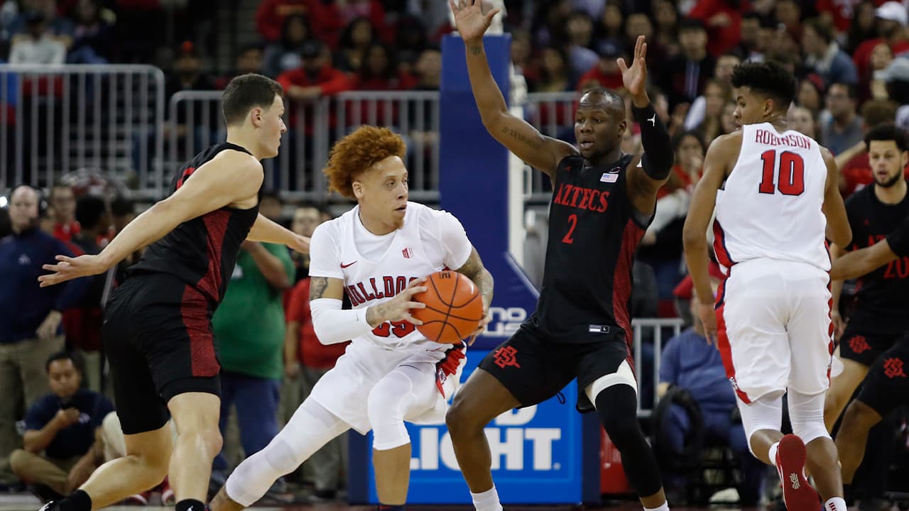 Photo of San Diego State players surrounding Fresno State's Noah Blackwell