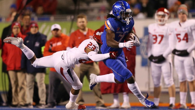 Photo of a Fresno State player tackling a Boise State player