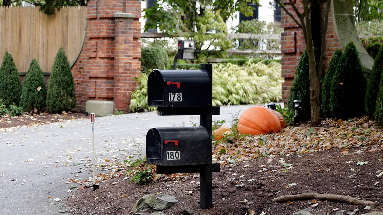 Photo of mailboxes stand outside the entrance to a house owned by philanthropist George Soros