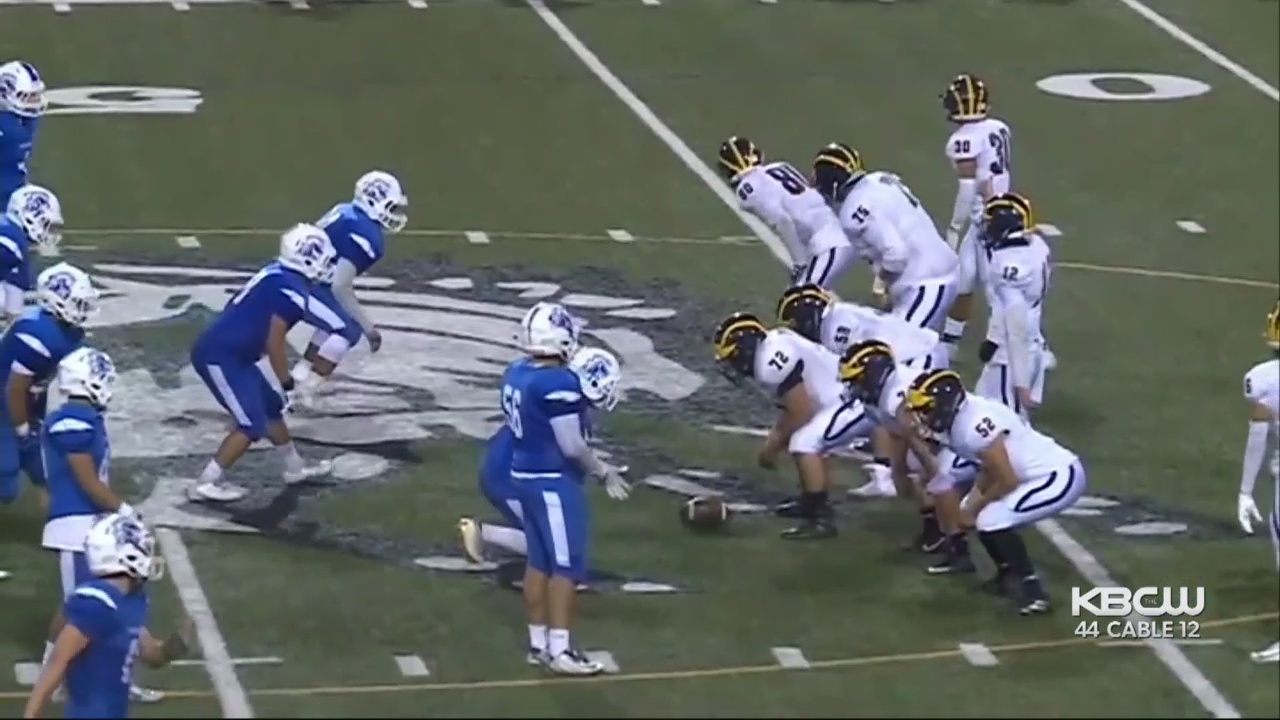 Photo of Gilroy High School football team in game action