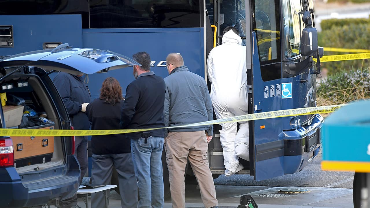 Photo of investigators outside of a Greyhound bus