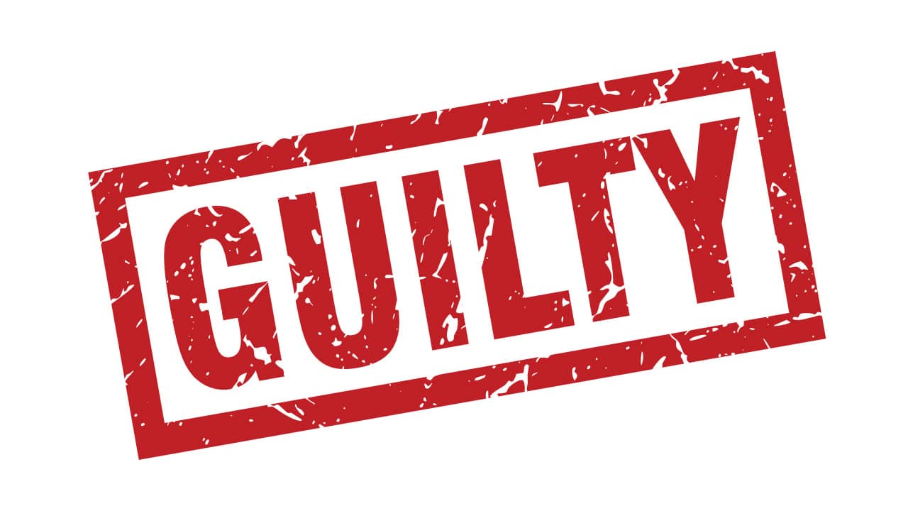 A red and white sign that says Guilty