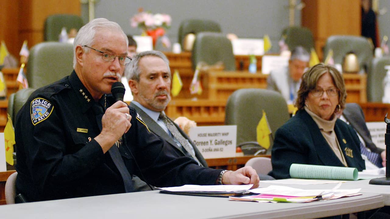 Photo of Mike Heal, left, police chief for the city of Aztec, N.M.