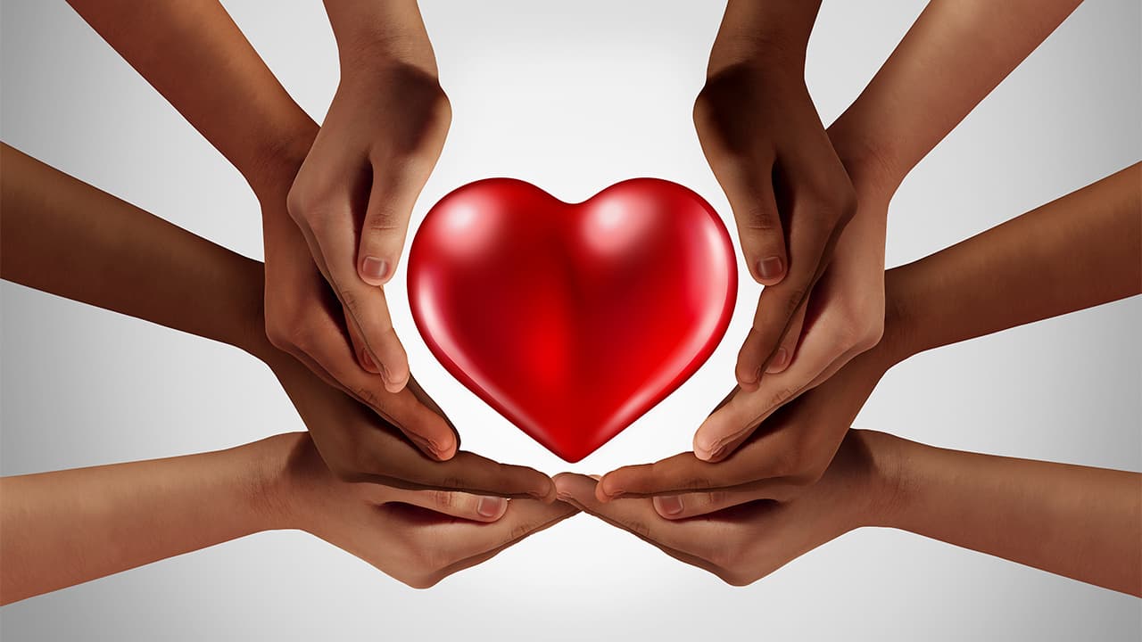 Picture of hands surrounding a heart symbolizing philanthropy