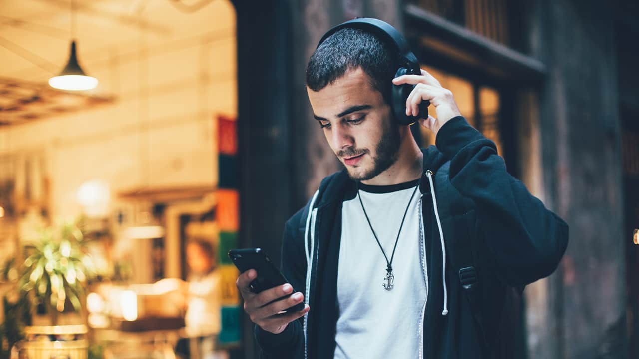 Photo of a man wearing headphones
