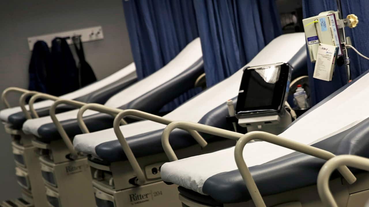Photo of beds set up inside a mobile hospital