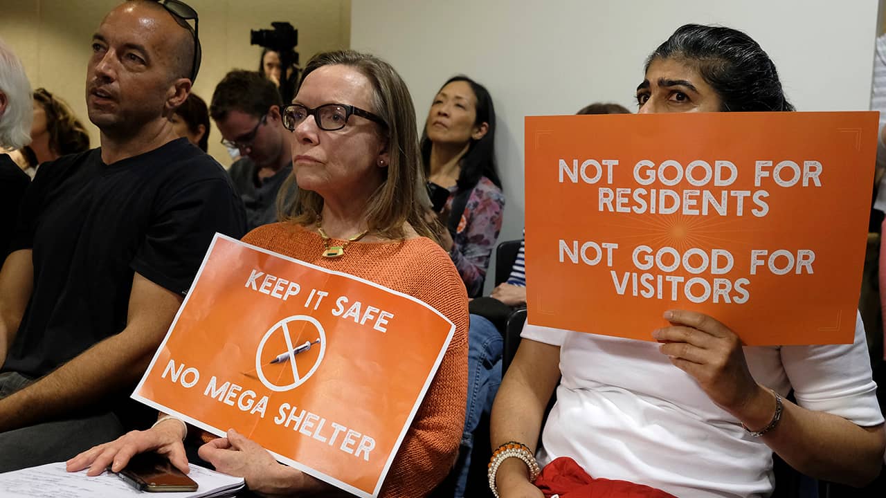 Photo of women opposing proposed homeless shelter