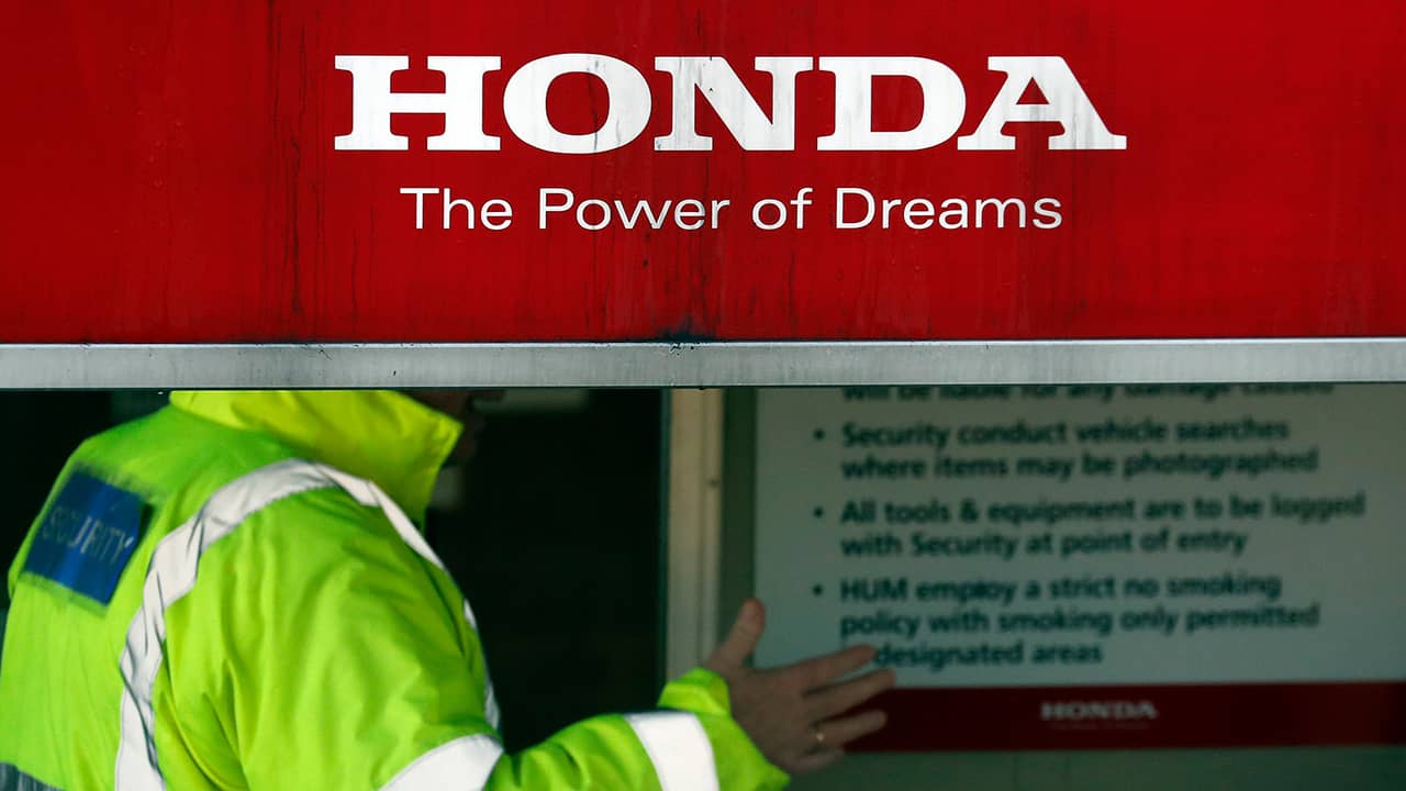 Photo of security guards at the entrance of a Honda car plant in Swindon