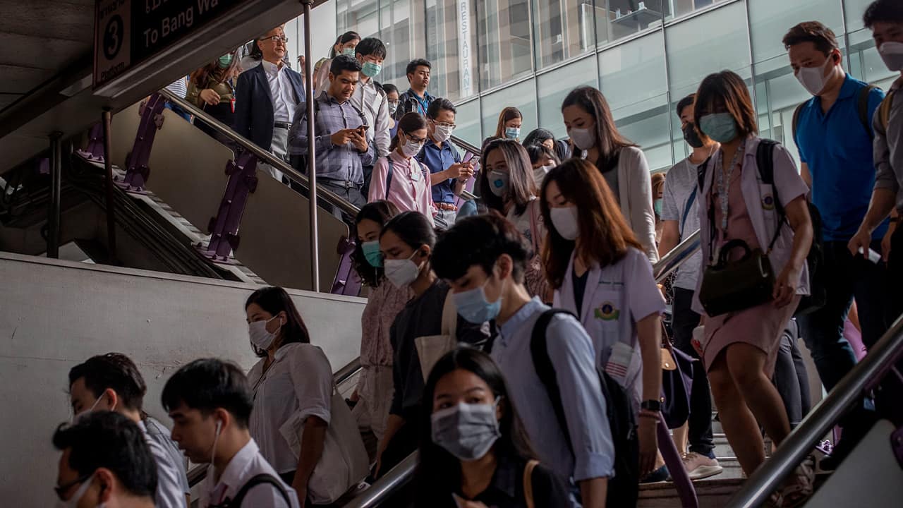 Photo of commuters wearing face masks 