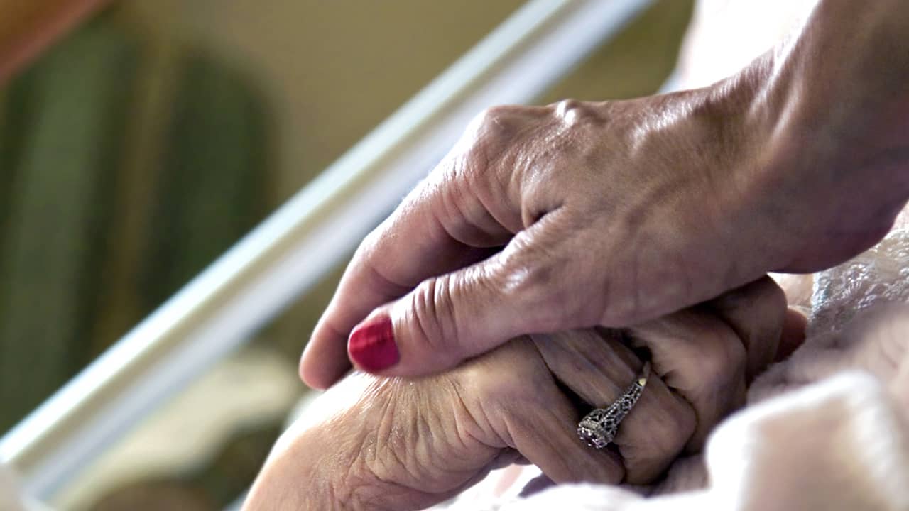 Hand in hand symbolizing hospice care