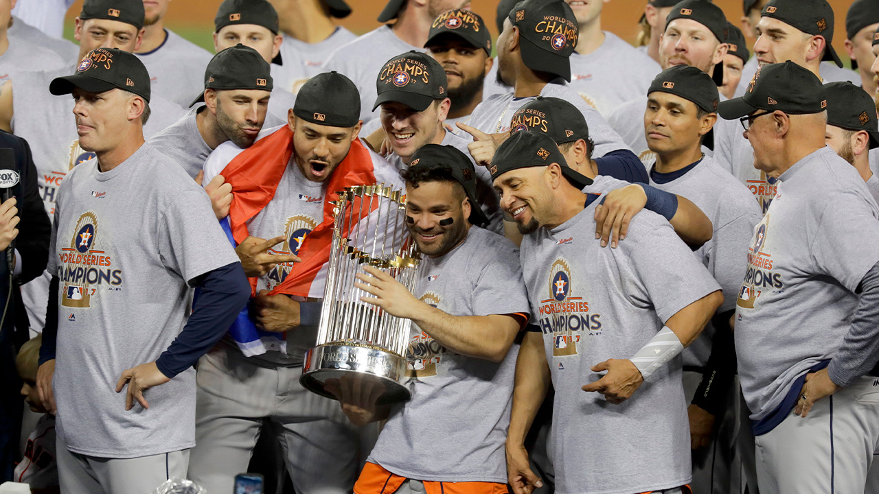 Photo of the Houston Astros celebrating with the trophy after their win against the Los Angeles Dodgers in Game 7 of baseball's World Series in Los Angeles