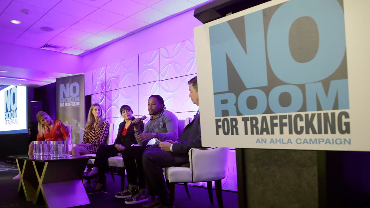 Photo of Miami Dolphins wide receiver Albert Wilson speaking during a meeting between law enforcement officials and hotel groups to announce a campaign to prevent human trafficking