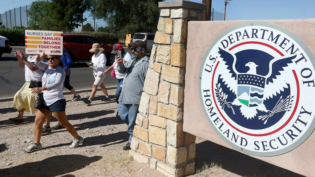 Photo of protesters walking outside the El Paso Processing Center