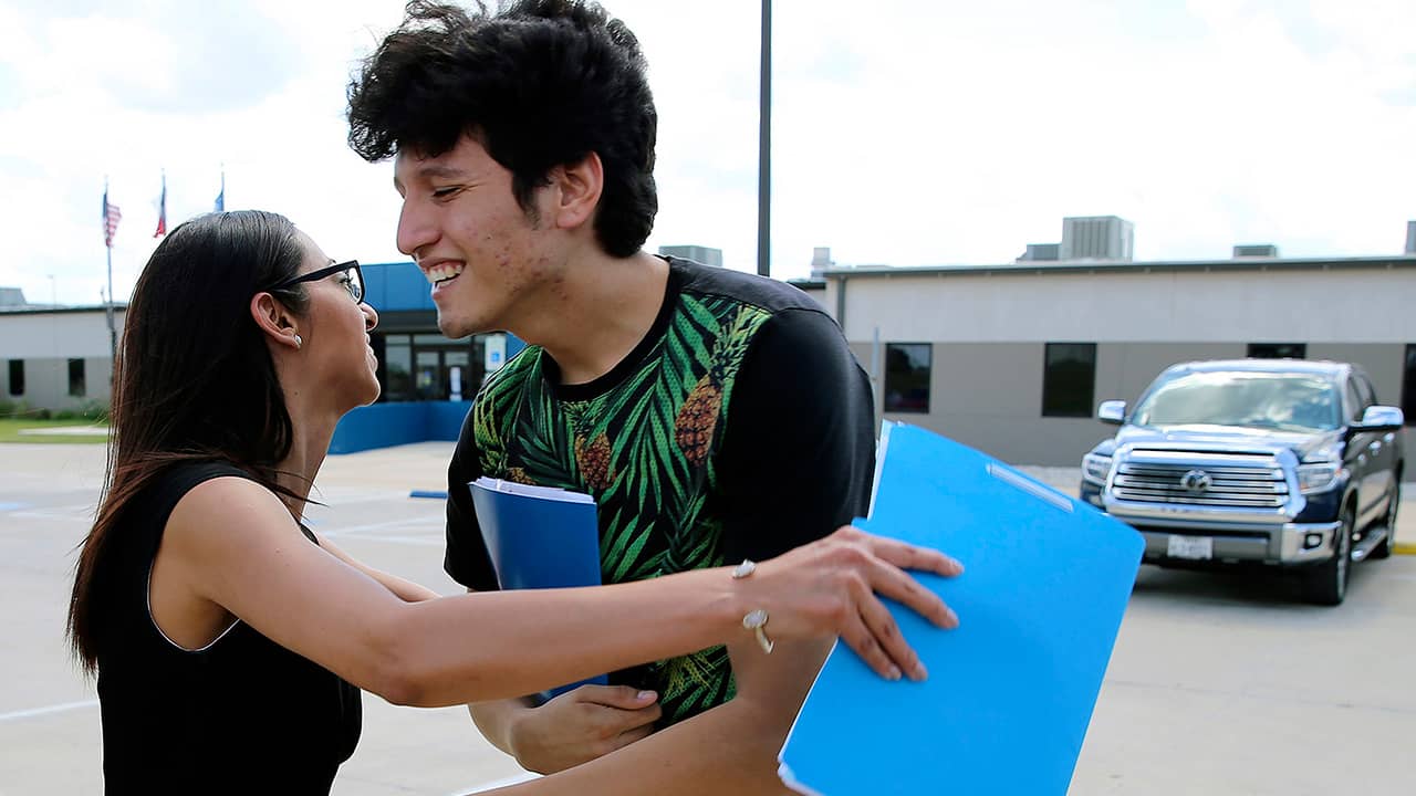 Photo of U.S. citizen Francisco Galicia, 18, getting a hug from his attorney