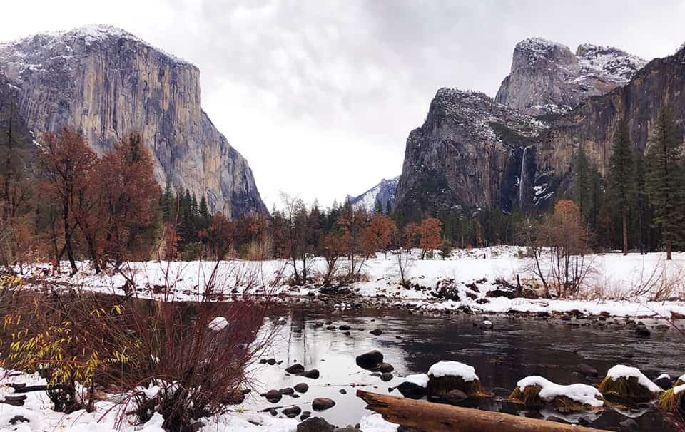 Snow blankets the Yosemite Valley floor during winter.
