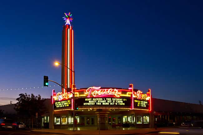 Photo of the Tower Theater and its neon tower at night's