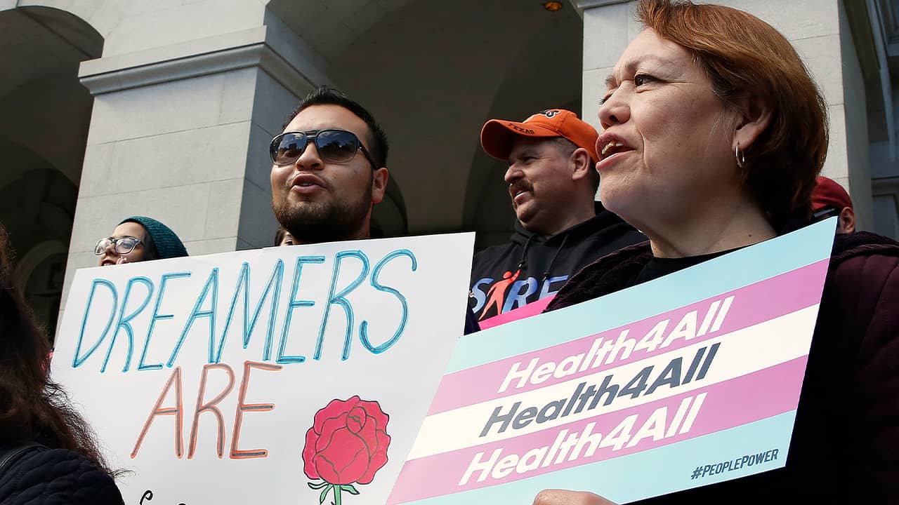 Photo of supporters of proposals to expand health coverage to immigrants in the country illegally