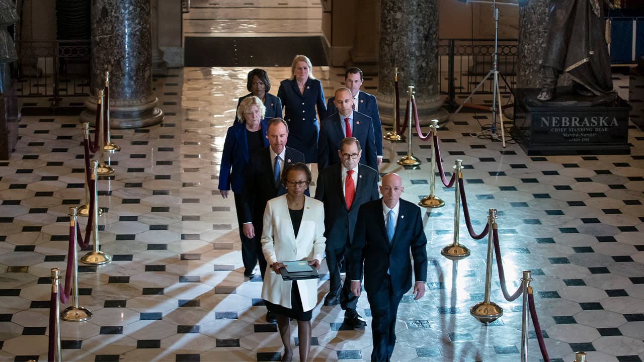 Photo of members of Congress delivering the articles on impeachment