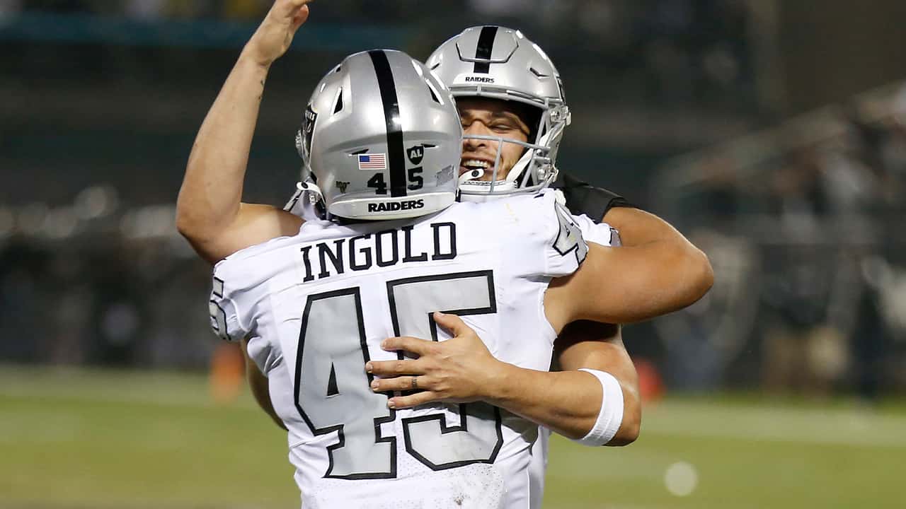 Photo of Derek Carr hugging Alec Ingold