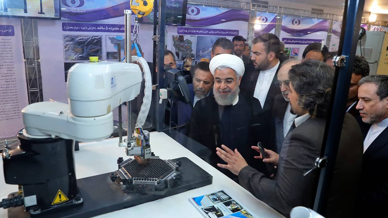Photo of President Hassan Rouhani listening to explanations on nuclear achievements 