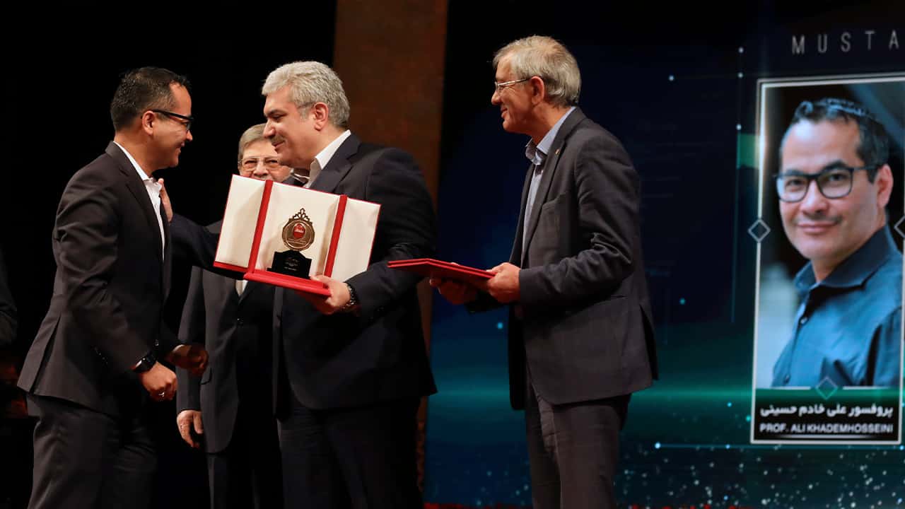 Photo of UCLA professor Ali Khademhosseini receiving an award