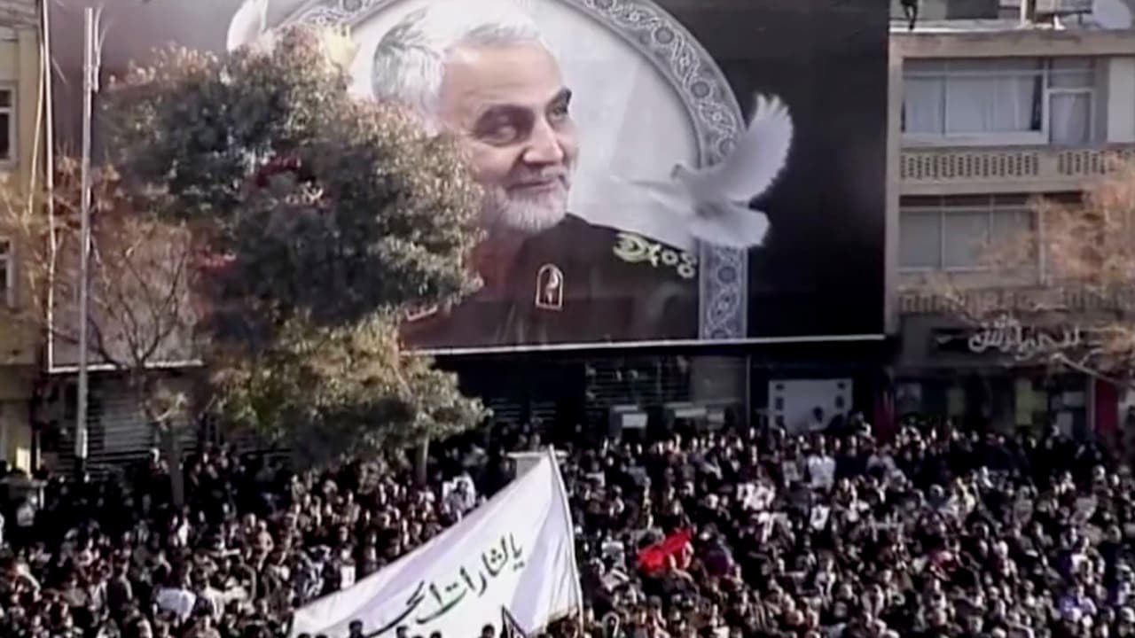 Photo of mourners gathering to pay their respects