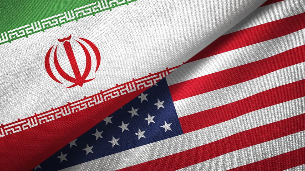 Photo of an Iranian flag and American flag