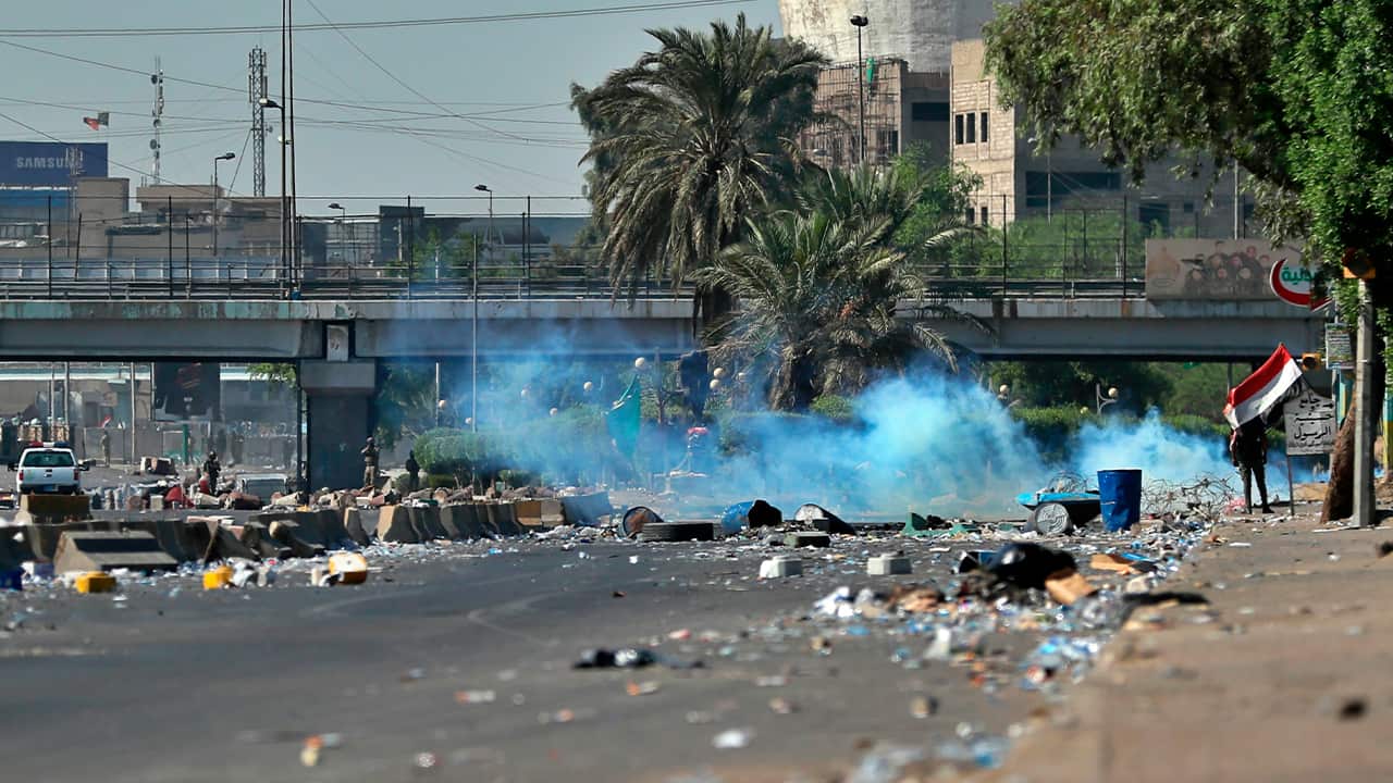 Photo of Iraqi security forces using tear gas
