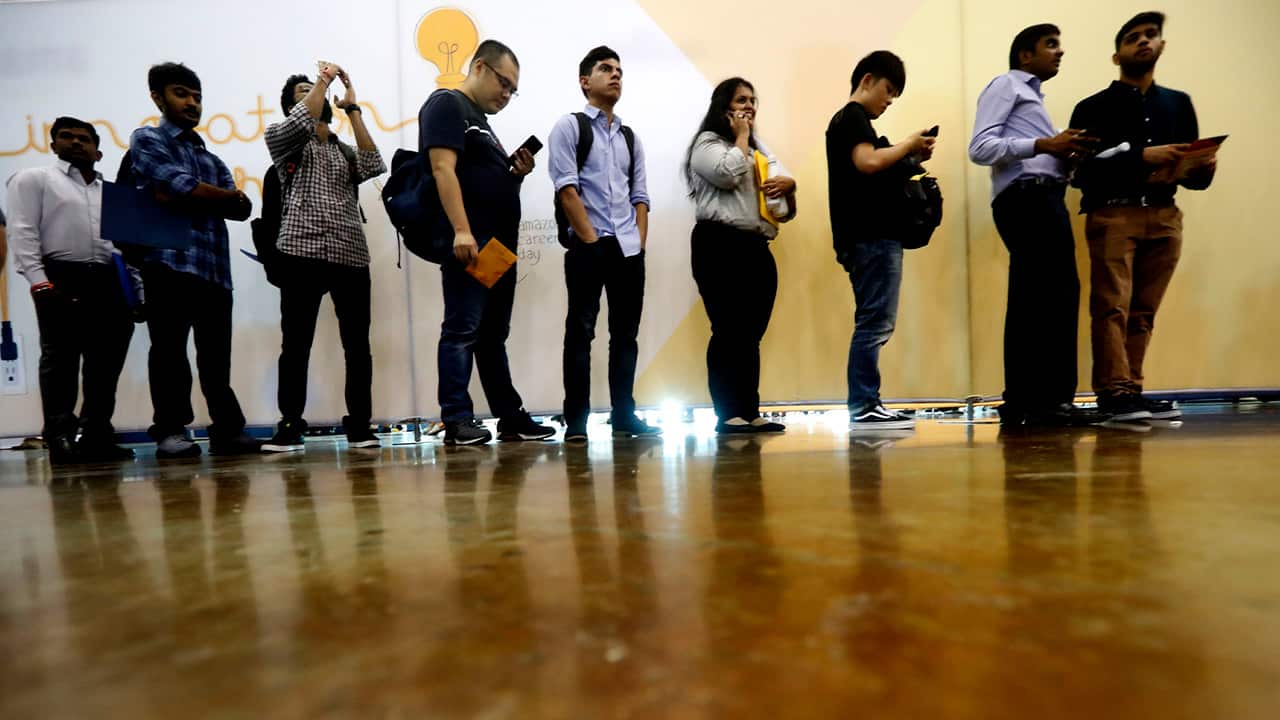 Photo of job seekers lining up at a job fair