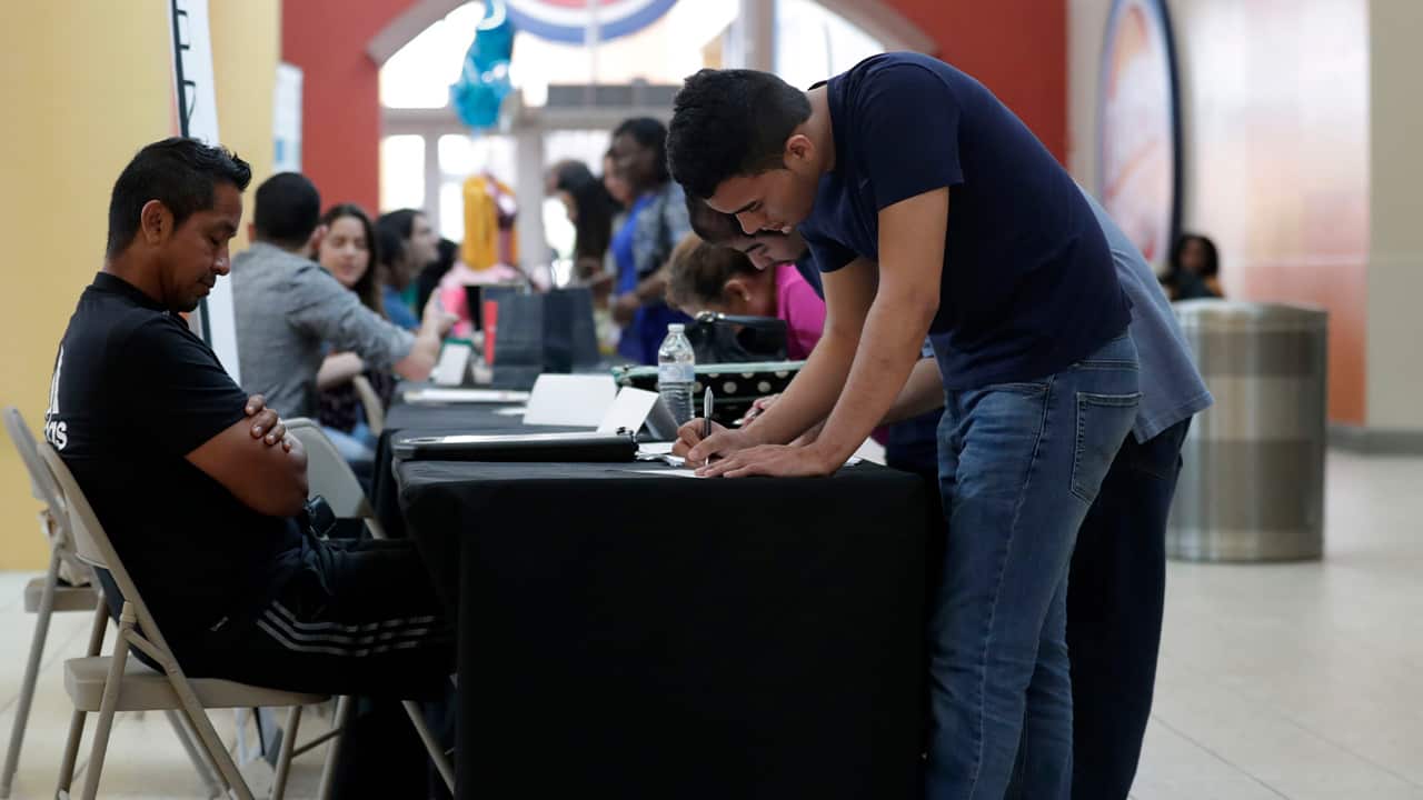 Photo of a man filling out a job application