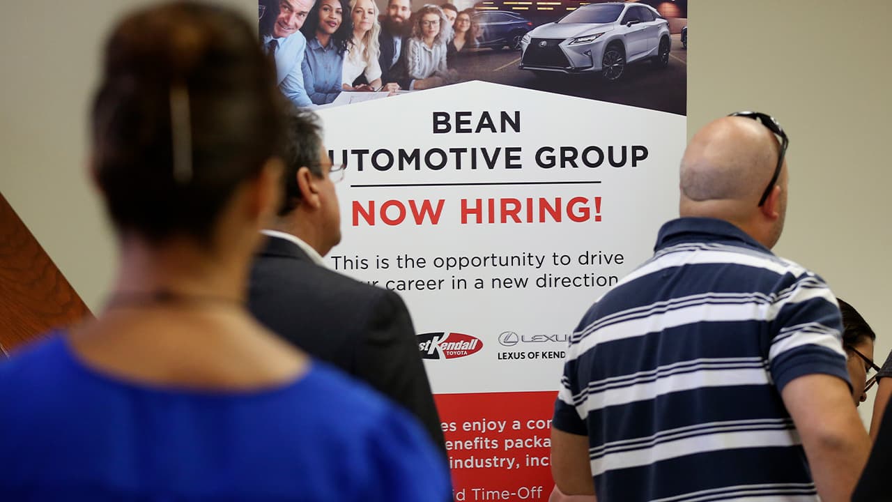 Photo of people in line at a job fair