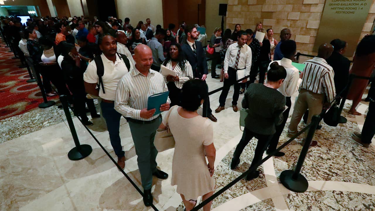 Photo of job applicants lined up during a job fair in Hollywood, Fla.
