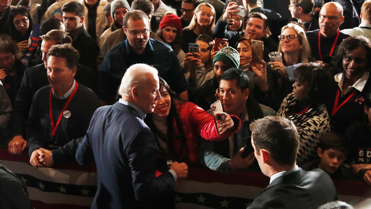 Photo of Joe Biden walking in a crowd 