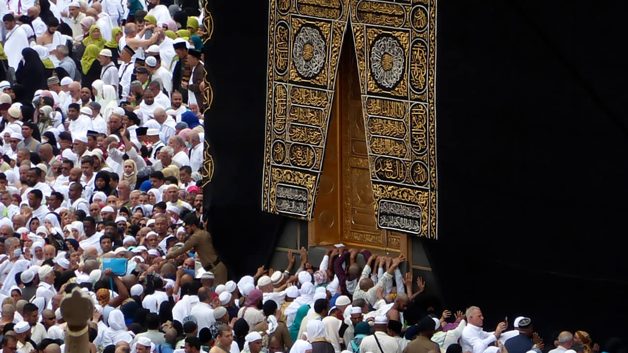 Photo of Muslims praying near the Kaaba 