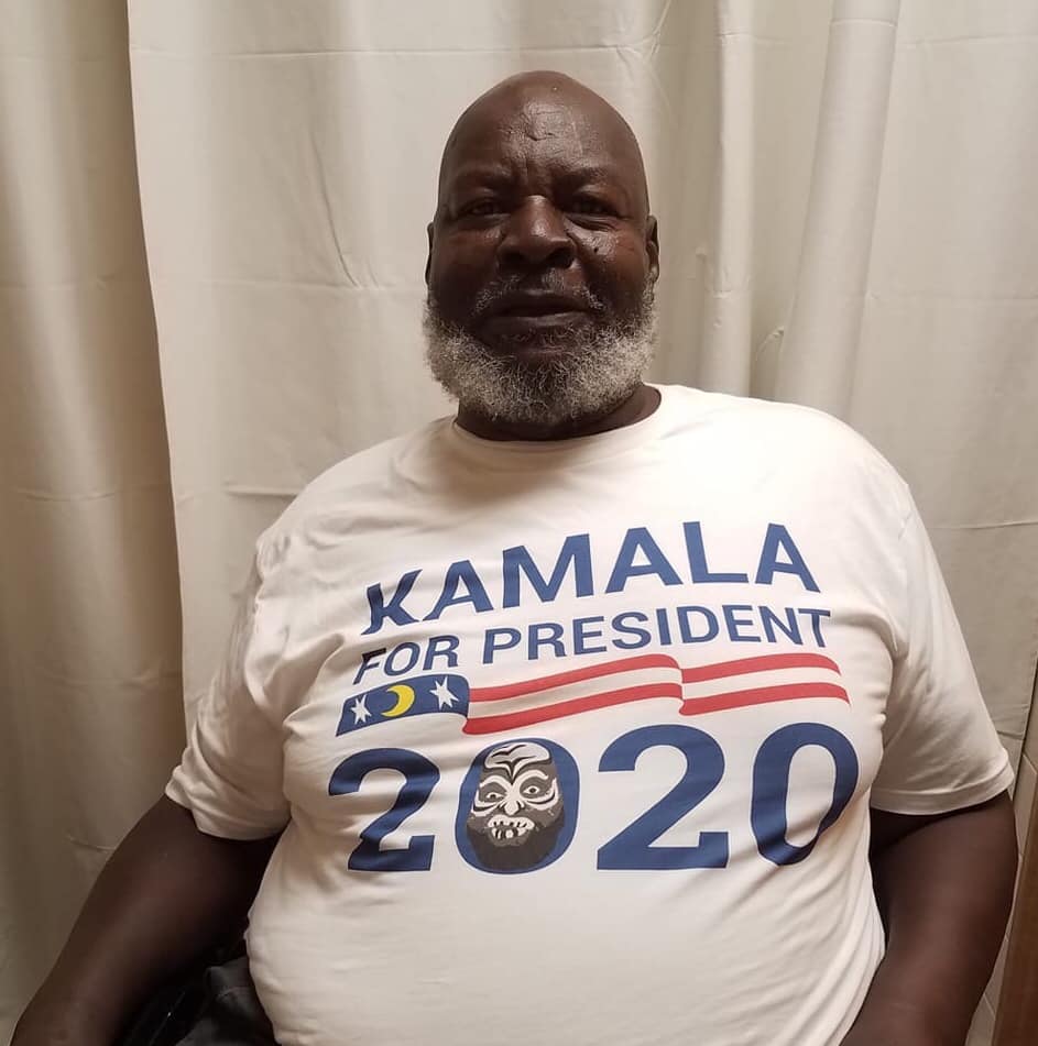 Photo of former pro wrestler James "Kamala" Harris wearing a Harris for President 2020 t-shirt