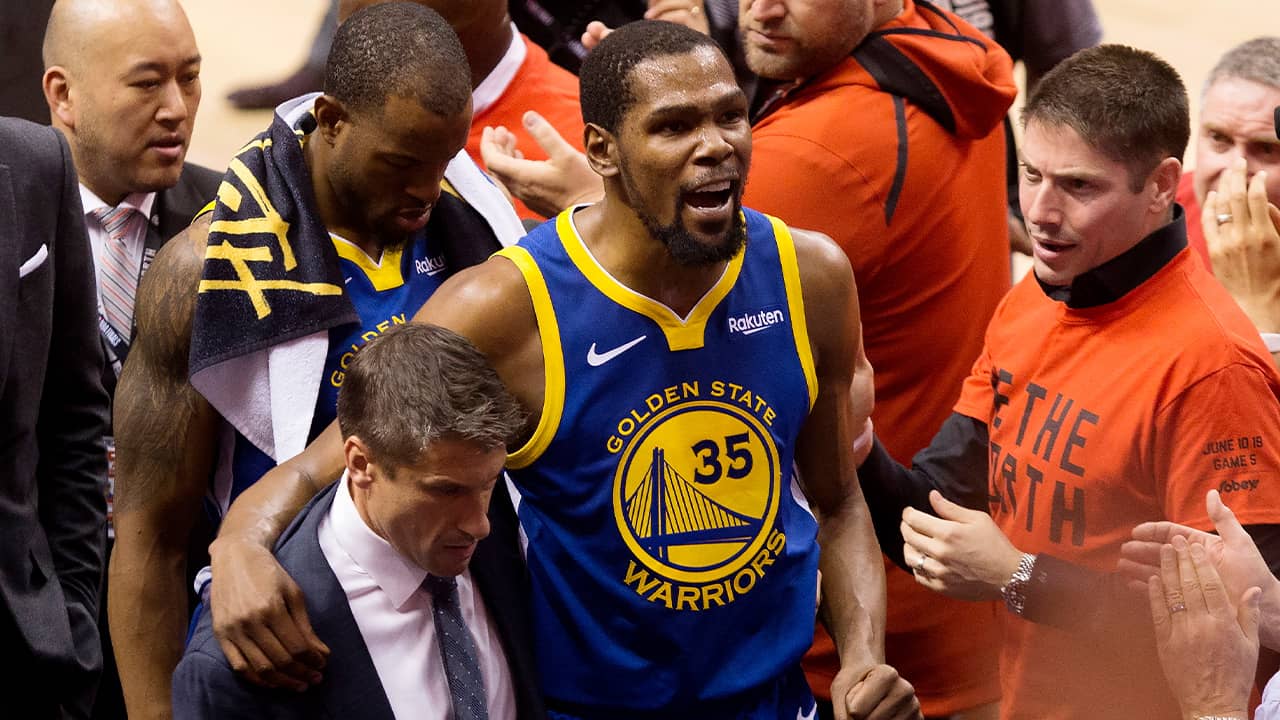 Photo of Kevin Durant reacting as he leaves the court after sustaining injury during Game 5