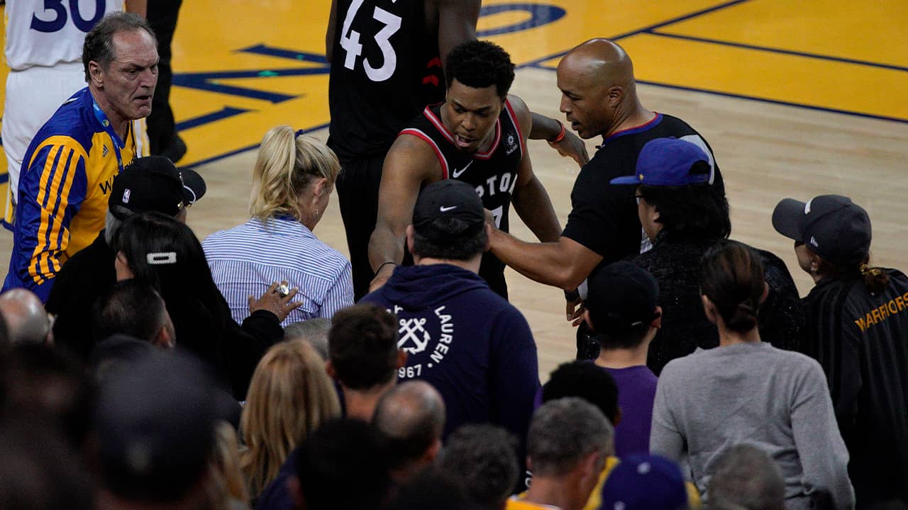 Photo of Kyle Lowry gesturing next to referee Marc Davis at Game 3 of the NBA Finals in Oakland, CA.