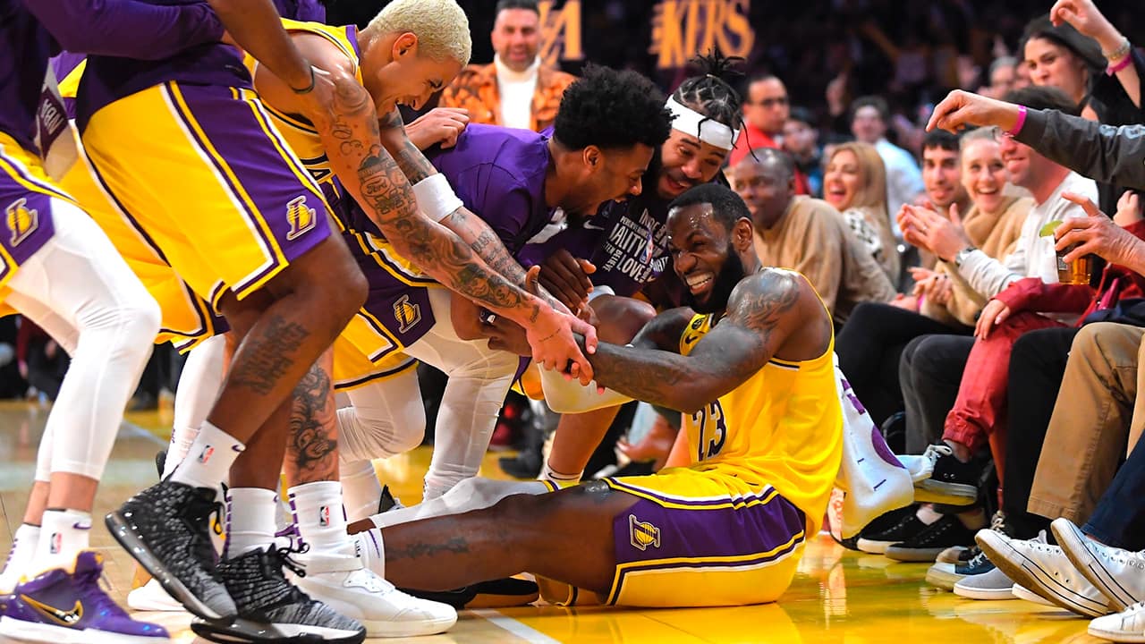 Photo of the Los Angeles Lakers swarming LeBron James