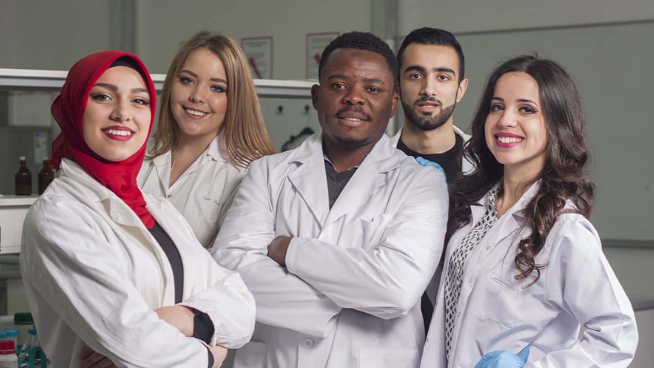 Photo of lab workers smiling