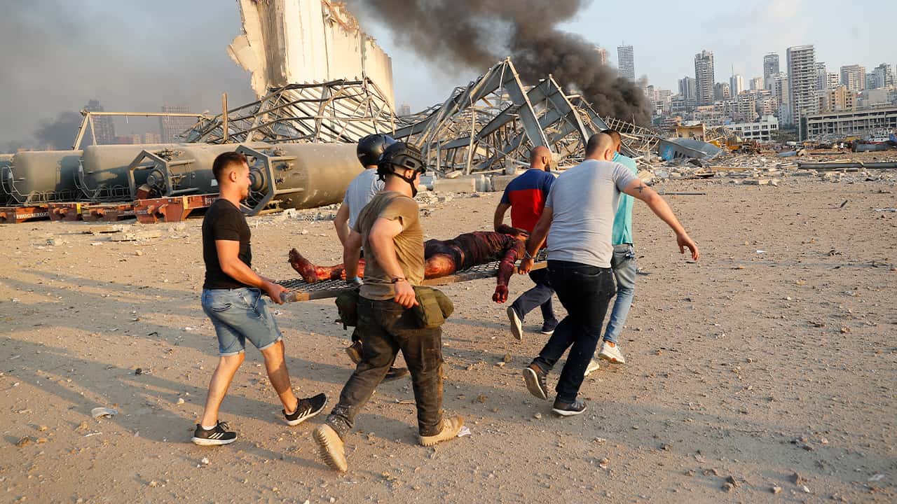 Photo of civilians carrying a victim