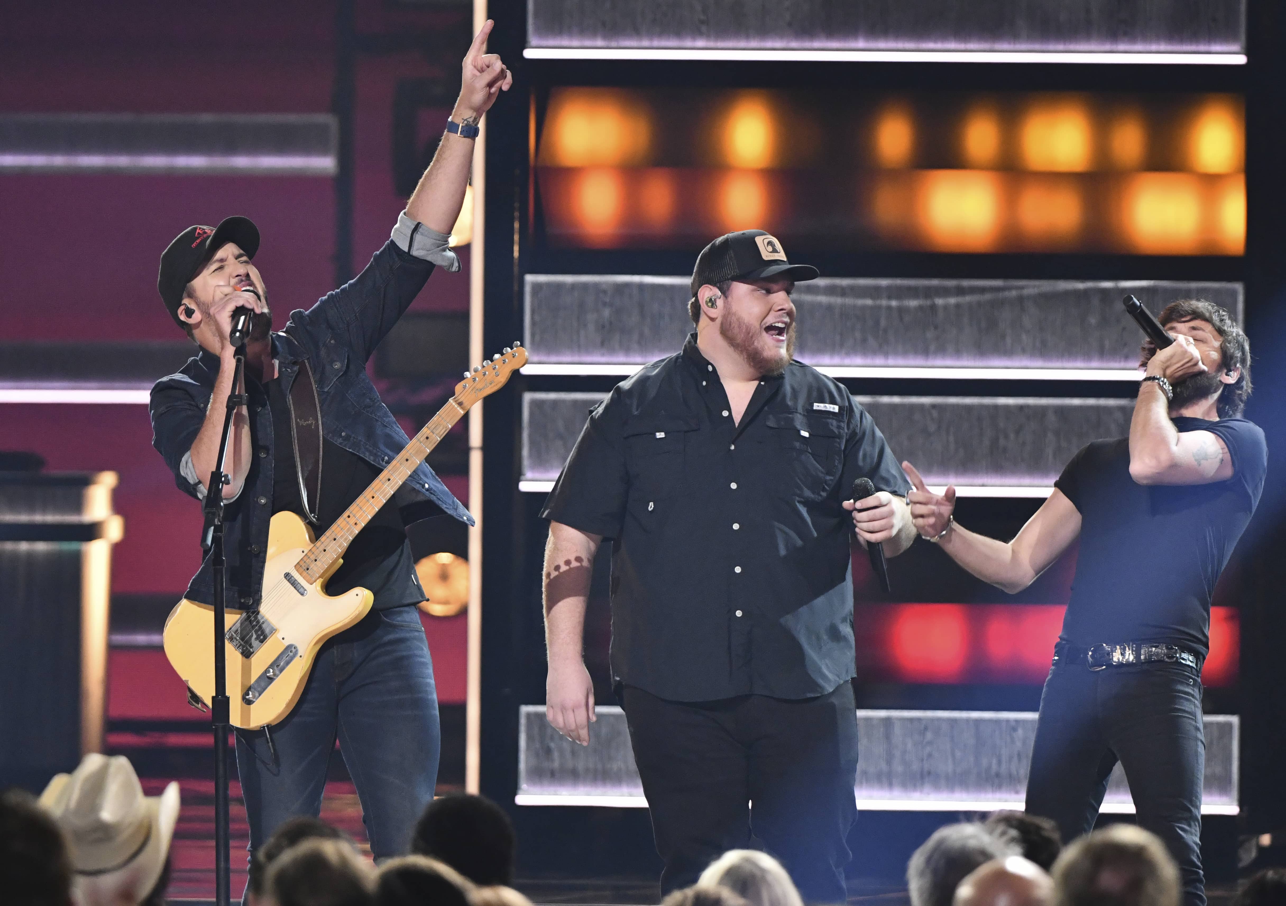 Photo of Luke Bryan, Luke Combs, and Chris Janson