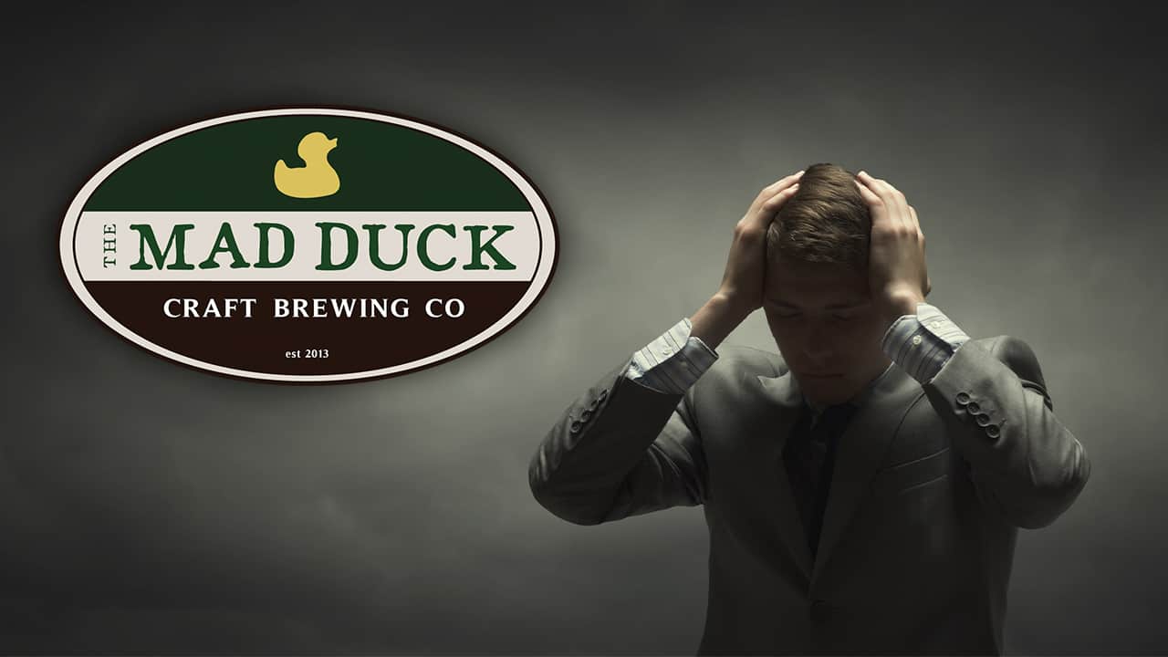 Composite image of a frustrated business owner and the logo for Fresno's Mad Duck Brewing restaurants