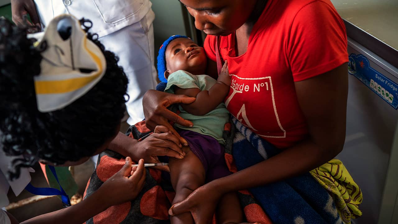Photo of a Migowi child getting a malaria vaccine