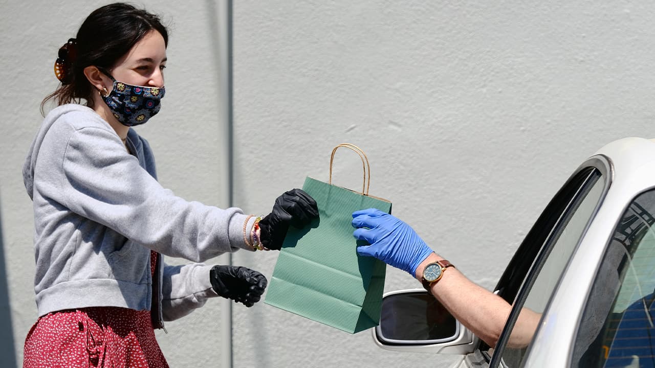 Photo of a woman delivering cannabis products 
