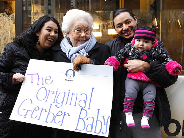 Photo of the Montoya family with the original Gerber baby, Ann Turner Clark